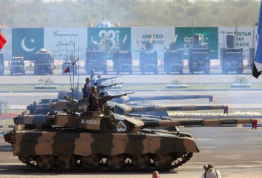 Soldiers drive Pakistan's Al Khalid tanks during Pakistan Day military parade in Islamabad, Pakistan
